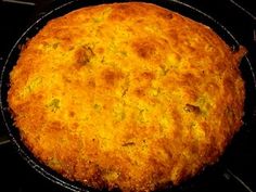 a close up of a pie in a pan on a stove top with a black background