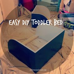 an easy diy toddler bed made out of plywood and cardboard with the words, easy diy toddler bed