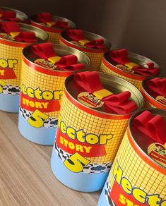 several yellow and red tins with bows on them