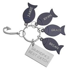 three fish shaped key chains with name tags attached to them, one is for grandpa's best catch and the other is for grandma's best catch