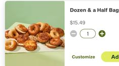 a white plate topped with donuts on top of a green tablecloth next to an ad for dozen and a half bagel