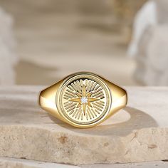 Ishtar is heavily associated with the planet Venus and the sacred feminin. Her primary element is the star, a representation of the brightest planet in the night sky. This ring incorporates stellar elements into an artful piece of jewelry. It also features a white stone, which is regarded as the stone of Venus.Carat Weight: 0.075 ctStone Size: 1.5 mmStone Type: Jeulia® StoneNumber of Stones: 1 Stone Shape: RoundStone Color: Diamond WhiteWeight: 4.8 gWidth: 3.1 mmHeight: 3.8 mmThickness: 1.2 mmMa Anniversary Jewelry Ring With Compass Design, Mystical Gold Jewelry For Promise, Symbolic Sun And Moon Star Jewelry, Celestial Star Jewelry For Anniversary, Celestial Star Shaped Signet Promise Ring, Yellow Gold Star-shaped Promise Jewelry, Celestial Style Ring With Polished Finish, Celestial Style Polished Ring, Gold Star Celestial Jewelry