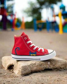 Introducing the I Like My Red Shoes | Pete the Cat Chucks by Androo's Art. These stylish and unique shoes are inspired by the beloved Pete the Cat character. These authentic Converse All-Stars have been given a one-of-a-kind makeover, making each pair unique and stylish. The bright red color is sure to make a statement and the classic Chuck Taylor design ensures comfort and durability. These shoes are perfect for any Pete the Cat fan and are sure to be a hit with kids and adults alike. Get your Playful Red High-top Sneakers, Playful Red Sneakers With Round Toe, Red Chucks, Pete The Cat, Cat Character, Unique Shoes, Converse All Star, Red Shoes, Chuck Taylor