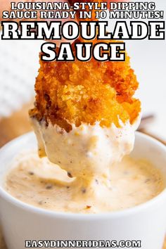 a spoon full of homemade remoulade sauce in a white bowl with text overlay