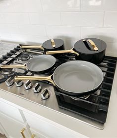 pots and pans are sitting on the stove top