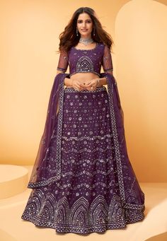 Purple net mirror work lehenga choli 1027C  Desc:  Style : Circular Lehenga Choli Color : Purple Fabric : Inner Santoon   Net Work : Mirror   Embroidery Occasion : Mehendi   Sangeet   Engagement   Reception   Ceremonial   Baby Shower Wash Care : Dry clean Sleeve Style : Half Sleeve Long Sleeves : Done only in Custom Stitch Sleeves Lining : Done only in Custom Stitch Bust Size: 32 to 42 Inches. With Express Free Shipping and Custom Stitching, Buy Indian Wedding Party Wear lehenga Purple net mirro Dark Purple Lehenga, Lehenga Purple, Purple Lehenga, Sari Lehenga, Mirror Work Lehenga, Designer Bridal Lehenga Choli, Purple Mirror, Bollywood Lehenga, Net Blouses