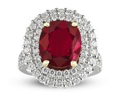 A brilliant 3.95-carat oval ruby radiates at the center of this elegant ring. The surrounding white diamonds, weighing 1.53 total carats, add to the dramatic glow of the striking gemstone. The diamonds form a bold double halo around the gem and extend down the ring's upper shank. The stones are set in 18k white gold. Ruby Jewelry Ring, Ruby And Diamond Ring, Kay Jewelry, Traditional Engagement Rings, Colored Gemstones, Ruby Diamond Rings, Art Deco Diamond Rings, Solitaire Pendant Necklace, Ruby Jewelry