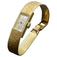 Modern and classic women's gold wrist watch. It has an elegant rectangular dial on a textured gold bracelet, Swiss made and timeless design. The movement is beautiful and works well, it just needs a new arm. It has a nice feeling to wear because of the weight of 18k gold. Stamped with hallmarks for 18 karat gold, Swiss hallmark, serial number and model number, mechanical Hand-Winding Watch. Gold Wrist Watch, Boho Watch, Rolex Wrist Watch, Vintage Watches Women, Personalized Watches, 18k Gold Bracelet, Gold Watches Women, Swiss Watch, Gold Armband