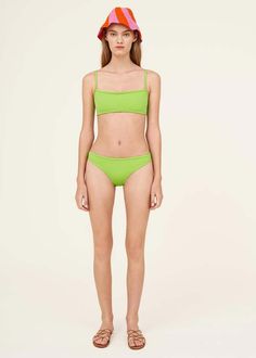 Swimwear designed for play sport and life outside the water denizeri pieces are meant to be worn throughout the day. with color comfort and versatility at its core denizeri is designed to be mixed matched and moved in for all ages and body types.    square neck bikini top with low rise bikini bottoms from denizeri in a bright bolt green italian fabric. wide-set straps back clasp closure elasticized waist self lined medium coverage tonal seamed binding. intended for sport swim and leisure use. Green Seamless Nylon Swimwear, Green Nylon Swimwear For Spring, Green Swimwear For Workout During Beach Season, Green Beachwear Bottoms For Water Sports, Sporty Seamless Green Swimwear, Green Sports Bottoms For Beach Season, Green Seamless Bottoms For Summer, Green Stretch Swimwear For Sports, Green Nylon Swimwear For Poolside