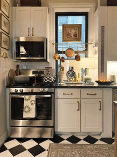 a kitchen with black and white checkered flooring