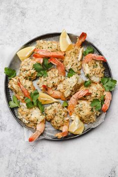 shrimp with lemon and parsley on a plate