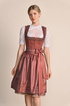 Description Item description Our chic dirndl Marielle is a dream come true for all our traditional costume lovers who want to combine a mix of classic elegance and tradition. The dirndl dress features romantic colors and traditional cuts. Dirndl Marielle is a classic eye-catcher thanks to its straight neckline with decorative frog-shaped trim along the neckline. The skirt impresses with its interesting diamond pattern. The shimmering apron adds a harmonious accent to the overall outfit. Our dirn Dirndl Blouse, Novelty Hats, Overall Outfit, Romantic Colors, A Dream Come True, Traditional Costume, Candle Accessories