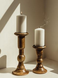 Wooden candle holders; one large and one small. Holder hold white candle on a white table. 6" Pillar Candle Holder, Post Candle Holders, Wood Candle Stand, Wood Candle Stick Centerpiece, 3 Books Riser For A Candle, Wooden Candle Stands, Candle Holders Decor Ideas, The Exploited, Pillar Candle Stand