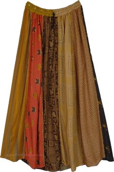 A traditional patchwork skirt in Mitti (earthen) shades, patched together and highlighted on the vertical panels by a thick bundled thread (dori) running from waist to hem to give a unique look.  This long skirt has an accordion pleat that starts smaller at the waist and gets larger towards the hem, this helps give a taller look. #tlb #Patchwork #MaxiSkirt #Peasant #Printed #bohemianfashion #Handmade #Doripatchworkskirt #HippiePatchworkSkirt #RecycledPatchworkSkirt Traditional Long Brown Skirt, Brown Patchwork Tiered Skirt, Bohemian Brown Patchwork Skirt, Moodboard Fillers, Chic Long Skirt, Long Brown Skirt, Skirt Patchwork, Traditional Patchwork, Mustard Skirt