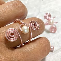 "This Rose Gold Wire Wrapped Ring is a unique and perfect gift, made with  6mm pearl and wrapped in non tarnish rose gold wire. Can be adjustable and is a perfect choice for an everyday outfit or any special occasion. If you are looking for a special gift for her, this is a lovely option. 🤩 Surprise your wife, girlfriend, best friend, bridesmaid or even yourself with this beautiful ring and make them feel how special they are for you.  All of the pieces of jewelry are handmade by myself and if Rose Gold Pearl Ring, Gold Wire Ring, Diy Wire Jewelry Rings, Gold Wrap Ring, Wire Jewelry Rings, Wire Jewelery, Ring Rosegold, Ring Pearl, Gold Pearl Ring