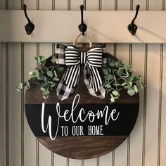 a welcome sign hanging on the wall