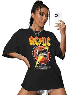 AC/DC Rock Band Women's T-Shirt by American Classics Part Scottish, part Aussie, 100% High Voltage Rock Legends! Formed in Sydney in 1973, AC/DC went from Dirty Deeds Done Dirt Cheap on the Highway to Hell to Back to Black in The Flick of the Switch! They have sold over 200 million albums worldwide and they are still working on new music. Wear some rock history, this cool ACDC Cannon Lightning Bolt Men's T-Shirt is vintage style print with a distressed look as if you bought it at an AC/DC Concer Acdc Oversized Shirt, Acdc Shirt Outfit, Dc Clothing, Acdc Shirt, 90s Bands, Rock History, Oversized Tees, Highway To Hell, Glitter Shirt