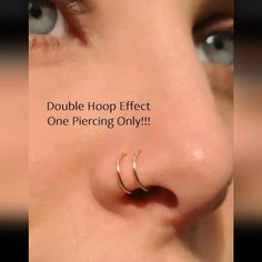 a woman's nose with the words double hoop effect one piercing only