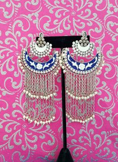 Gorgeous handmade long Indian meenakari dangly earrings, in chandbali design. Two tiers of dangling chains with pearl beads, suspended from colorful enamel crescent. Rows of clear crystals add bling. Feminine and so romantic They give a delicate effect. Lightweight and comfortable to wear. Weight is 8/10 ounce/ 23 grams. find even more great earrings here: https://www.etsy.com/shop/boutiquebymaryam?section_id=22797814 check out the rest of my shop here: https://www.etsy.com/shop/boutiquebymaryam Metal Chandbali Chandelier Earrings With Latkans, Dangle Metal Chandbalis With Latkans, Dangle Chandbalis With Latkans In Metal, Bollywood Style Metal Chandelier Earrings With Latkans, Bollywood Metal Chandelier Earrings With Latkans, Metal Chandbalis With Latkans, Metal Chandbali Danglers With Meenakari, Traditional Tassel Dangle Earrings For Festivals, Bollywood Chandbali Earrings With Dangling Beads