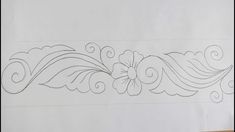 an image of a drawing on paper with some lines in the shape of flowers and swirls