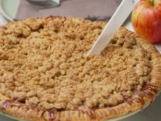 an apple pie sitting on top of a table