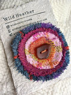 a close up of a button on a piece of cloth