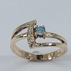 This stunning blue topaz ring has been carefully crafted in warm yellow gold , authentic blue topaz and diamonds. This ring would make a great any occasion/birthday gift! This  ring will not go unnoticed. All of my jewelry is handmade from scratch and of high quality. A tracking shipping number will be provided to you once the ring has been mailed. Ring measurements and materials: Ring is size 6  but can be resized at no extra cost and will be shipped to you in an elegant gift box. Ring Weight: Gold Diamond Ring With Blue Topaz In Round Cut, Gold Blue Topaz Diamond Ring For Anniversary, Gold Blue Topaz Ring For Promise, Gold Blue Topaz Promise Ring, Blue Topaz 14k Gold Promise Ring, Blue Topaz Ring With Round Cut And Tension Setting, Blue Birthstone Ring With Tension Setting, Blue Topaz Ring In Yellow Gold For Promise, Gold Birthstone Ring With Blue Topaz And Accent Stones