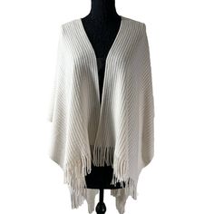 Wrap yourself in warmth with this beautiful cream shawl from LOFT. this 36-inch long wrap is perfect for the winter, fall, and spring seasons. The wrap features fringe accents and a ribbed stretch knit design that adds a classic and stylish touch to any outfit. New with tags - MSRP $69.50 Cream Shawl, Poncho Shawl, Ivory Sweater, Sweater Knit, Spring Season, Brands Outlet, Knitting Designs, The Winter, Scarf Wrap