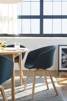 two chairs sitting at a table in front of a window