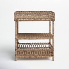 a wicker shelf with two baskets on it's top and bottom tiers