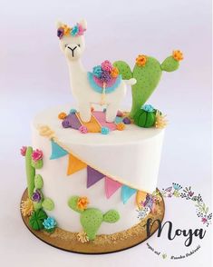 a cake decorated with an image of a llama and cactus