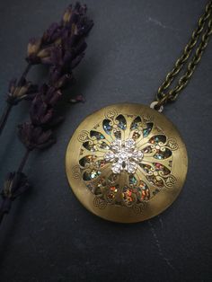 PLEASE read my shop announcement before placing an order so you know what to expect right now. Plus, when ordering from outside Europe, don't forget to provide a phone number for the courier to ensure the fastest and smoothest delivery. Perfect winter snowflake locket necklace: Victorian Vintage style locket necklace with a rhinestone snowflake adornment on its cover, and a sparkly crystal like resin cabochon inside, put there to let that magical glow be seen thru the filigree cutout cover. Perf Nickel-free Bronze Locket Necklace As Gift, Nickel-free Bronze Locket Necklace Gift, Antique Finish Medallion Necklace As Gift, Antique Finish Medallion Necklace Gift, Vintage Charm Locket Necklace With Flower Pendant For Gift, Bronze Medallion Locket Necklace For Gift, Bronze Medallion Locket Necklace Gift, Bronze Nickel-free Locket Necklace For Gift, Bronze Metal Locket Necklace As Gift