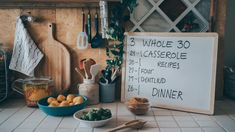 a kitchen counter topped with lots of different types of food and cooking utensils