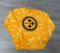 *If you wanna rep your team and not spend a fortune, I'm your girl! *My line of team tees and sweatshirts are all hand dyed, so no two are exactly the same! *All tees and sweatshirts can be done semi-cropped or left original. *If you don't see your team just message me and we'll make it happen! Sporty Tie Dye T-shirt With Crew Neck, Sporty Tie-dye T-shirt With Crew Neck, Bleached Crew Neck Sweatshirt For Streetwear, Buffalo Bills Apparel, Steelers Sweatshirt, Semi Cropped, Rochester Ny, Your Girl, Buffalo Bills