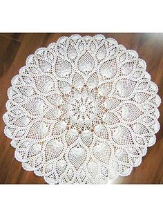 a white doily on a wooden table