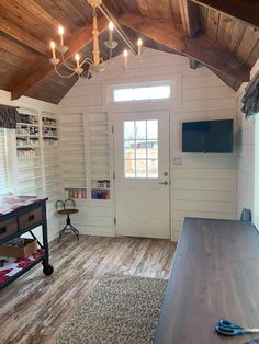 a room with wooden floors and white walls