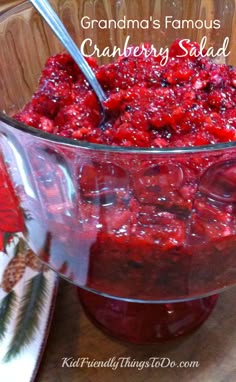 a glass bowl filled with cranberry salad