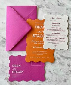 wedding stationery and envelopes on a marble surface