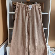 Nwt In Brown. Size L. Soft, Lightweight Cotton Fleece Fabric. Front Pockets. Elastic Drawstring. Loose Wide Leg Throughout. Beige Pants With Pockets For Lounging, Relaxed Beige Pants For Fall, Baggy Beige Bottoms For Loungewear, Baggy Beige Pants For Loungewear, Beige Lounging Pants With Pockets, Beige Wide-leg Sweatpants For Fall, Beige Baggy Pants For Loungewear, Beige Wide Leg Lounge Pants With Pockets, Beige Wide Leg Loungewear Pants With Pockets