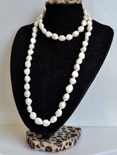 Material : Genuine Freshwater Pearl Length : 32 inch ready to wear necklaces Shape : Rice Nugget Shape Bead Size: 9-10 x 11-12 mm Color : Natural White Color as Pictured Shipping : FREE DOMESTIC SHIPPING via USPS First Class Package within U.S. We ship all orders within 24 hours from the U.S. (We closed on Saturday and Sunday) COUPON DISCOUNTS : QUALITYBEAD05008 ---- 8% Discount with Purchase at : $50 - $99 QUALITYBEAD10010 ---- 10% Discount with Purchase at : $100 - $149 QUALITYBEAD15012 ---- 1 Classic White Handmade Beaded Necklaces, Classic Handmade White Beaded Necklaces, White Oval Beaded Jewelry, White Oval Adjustable Necklaces, Adjustable Oval White Necklaces, White Adjustable Oval Necklaces, Long Pearl Necklace, Necklaces Long, Colored Rice