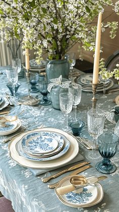 the table is set with blue and white dishes