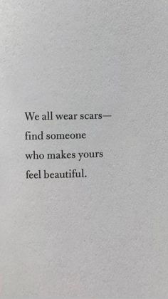 an old book with the words we all wear scars find someone who makes your feel beautiful