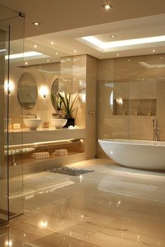 a bathroom with a tub, sink and large mirror on the wall next to it