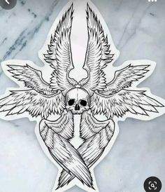 a sticker with an image of a skull and two wings on the back of it