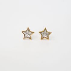 Add a touch of celestial elegance to your look with these stunning sparkling star earrings.  These earrings feature delicate gold stars adorned with mesmerizing silver glitter. The combination of gold and silver creates a dazzling contrast, making them the perfect statement accessory for any occasion. Whether you're dressing up for a night out or adding a touch of sparkle to your everyday style, these earrings are sure to catch everyone's eye. Designed to be lightweight and comfortable, they are Star Stud Earrings, Stud Earrings Gold, Titanium Earrings, Sparkling Stars, Star Earrings Stud, Celestial Jewelry, Glitter Stars, Star Studs, Elegant Earrings