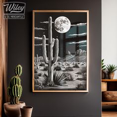 a cactus plant sitting in front of a painting on the wall