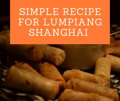 some food is sitting on a table with the words simple recipe for lumpiang shanghai