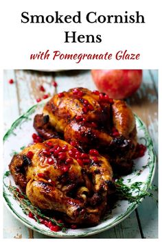 the cover of smoked cornish hens with pomegranate glaze on a plate