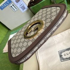 Coming from the House's archives, a round shaped version of the Interlocking G logo is reintroduced for Gucci Love Parade. Crafted from emerald green leather, this shoulder bag is completed by a delicate chain strap, infusing this accessory with a refined feel. Gold-toned hardware Round Interlocking G Leather shoulder strap with 15.4" drop Magnetic closure Small: 11"W x 6.3"H x 1.6"D Made in Italy Delivery 5-8 or 10-15 working days Please note that during high season and Sale period, delivery times may be affected We accept payment with a Credit card, Debit card, or PayPal.Note: Our Items are totally New High quality Brand Inspired Refurbished. Please make sure you are well aware of it before buying any of the Item. T&C's Apply in case of refunds.Please send us message on below chat to con Luxury Experience, Green Leather, Chain Strap, Gucci Bag, Real Leather, Luxury Bags, Contact Us, Paper Bag, Clutch Bag