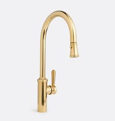 a gold faucet with the handle extended to it's side spout